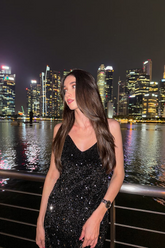 a lady in a black velvet sequins slip dress